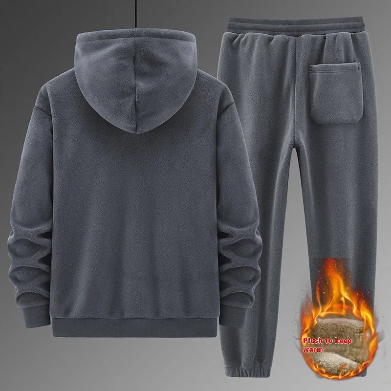 Grey cashmere hooded sweater and matching pants casual sports suit laid flat.