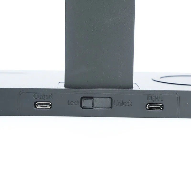 Black multi-function wireless charging station with USB ports for phones watches and headphones