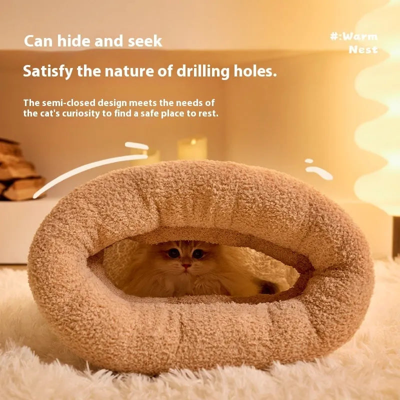 Brown semi-enclosed pet sleeping bag with plush lining on a wooden floor.