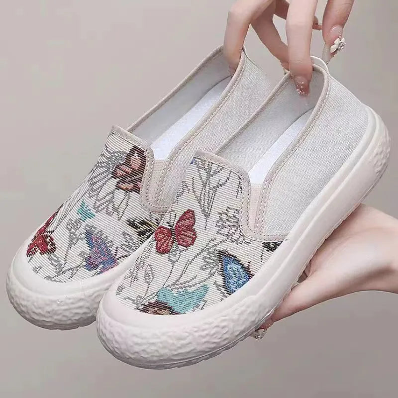 Old Beijing women's slip-on canvas shoes in black or white with a round toe and shallow cut.