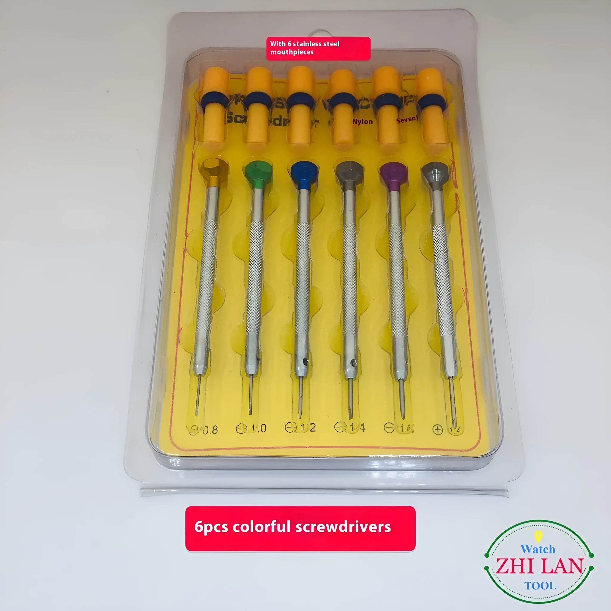 Six colour-coded watch repair screwdrivers with aluminium and copper handles laid out on a surface.