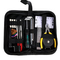 Black plastic case open to show metal guitar repair tools for maintenance