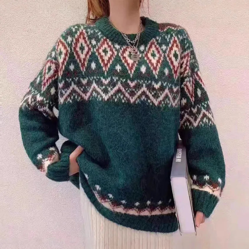 A woman wearing a loose red and white striped long-sleeved knitted pullover top.