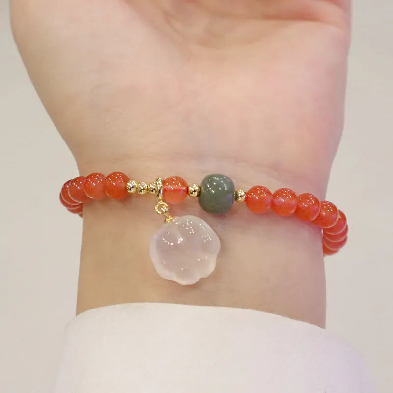 Natural red agate bracelet with cat paw design in gem inlay, 6mm width