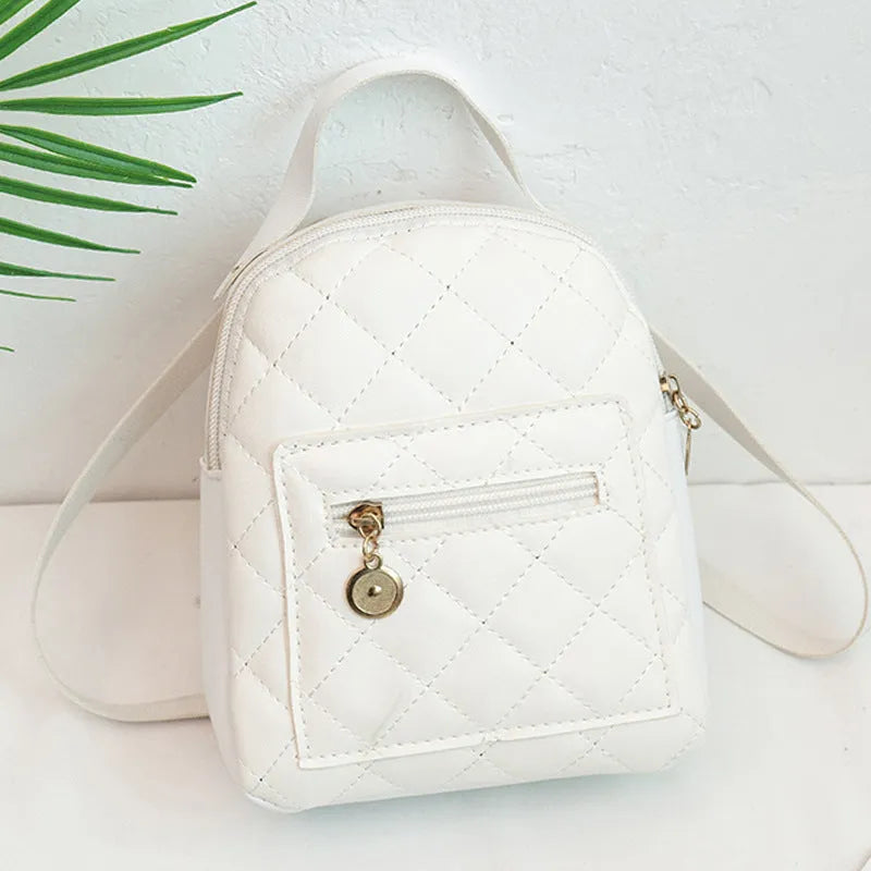 Girls' square hard PU backpack with embroidery, soft handle, in white, black, or pink.