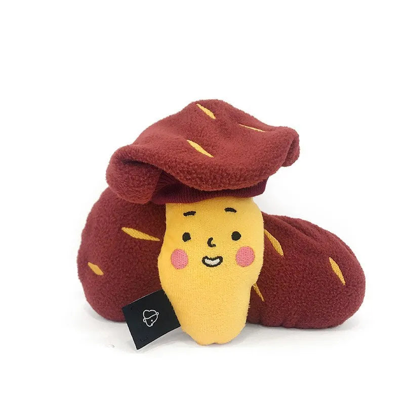 Red fabric pet toy shaped like sweet potato with internal hidden treat pockets for dogs