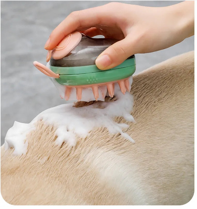 Blue and green pet bathing brush with integrated shampoo dispenser and silicone bristles.