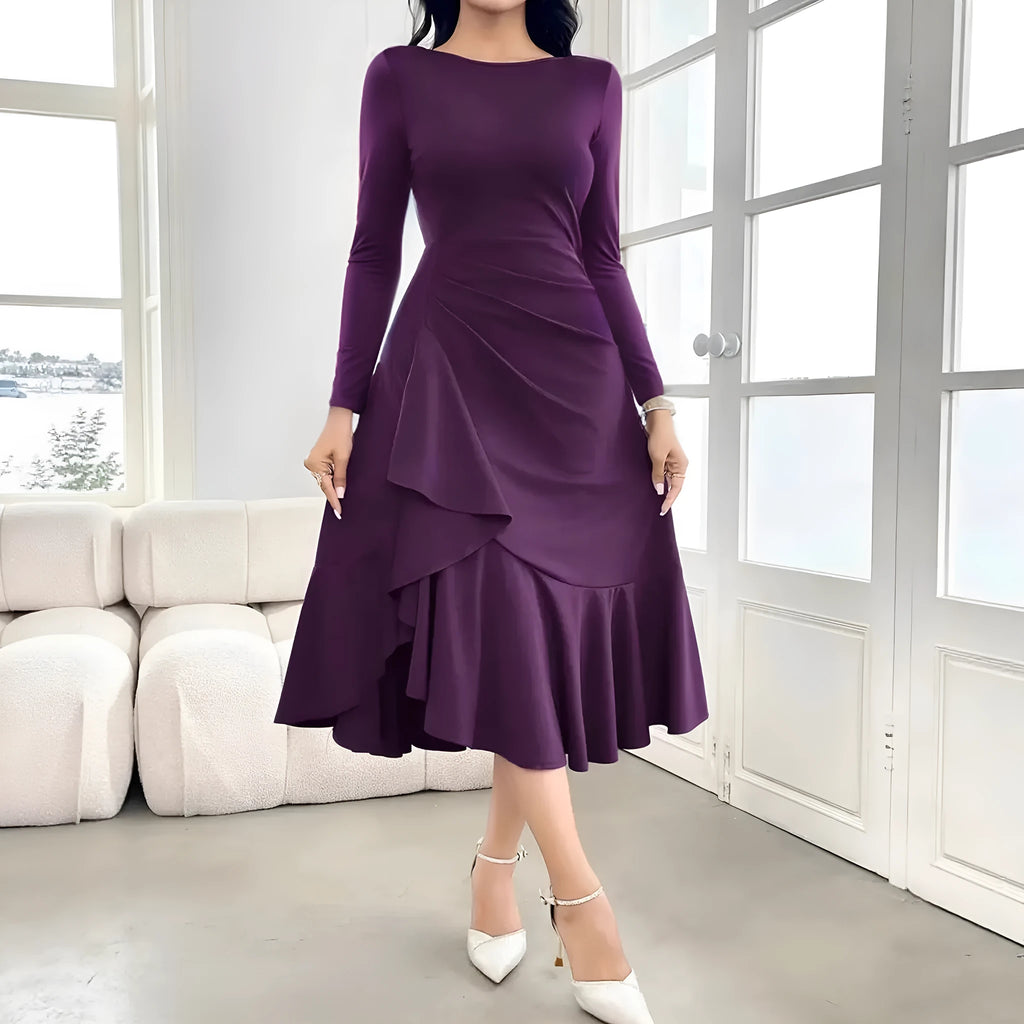 Purple women's long sleeve pullover dress with ruffled detail on a mid waist.