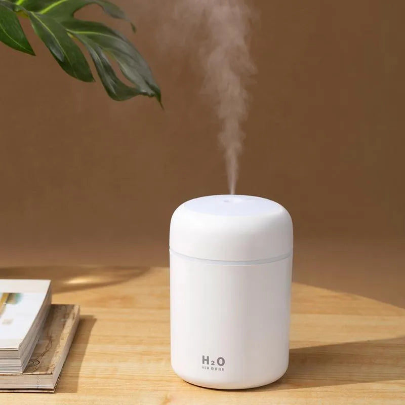 Pink USB desktop humidifier with LED lights and 300ml water tank