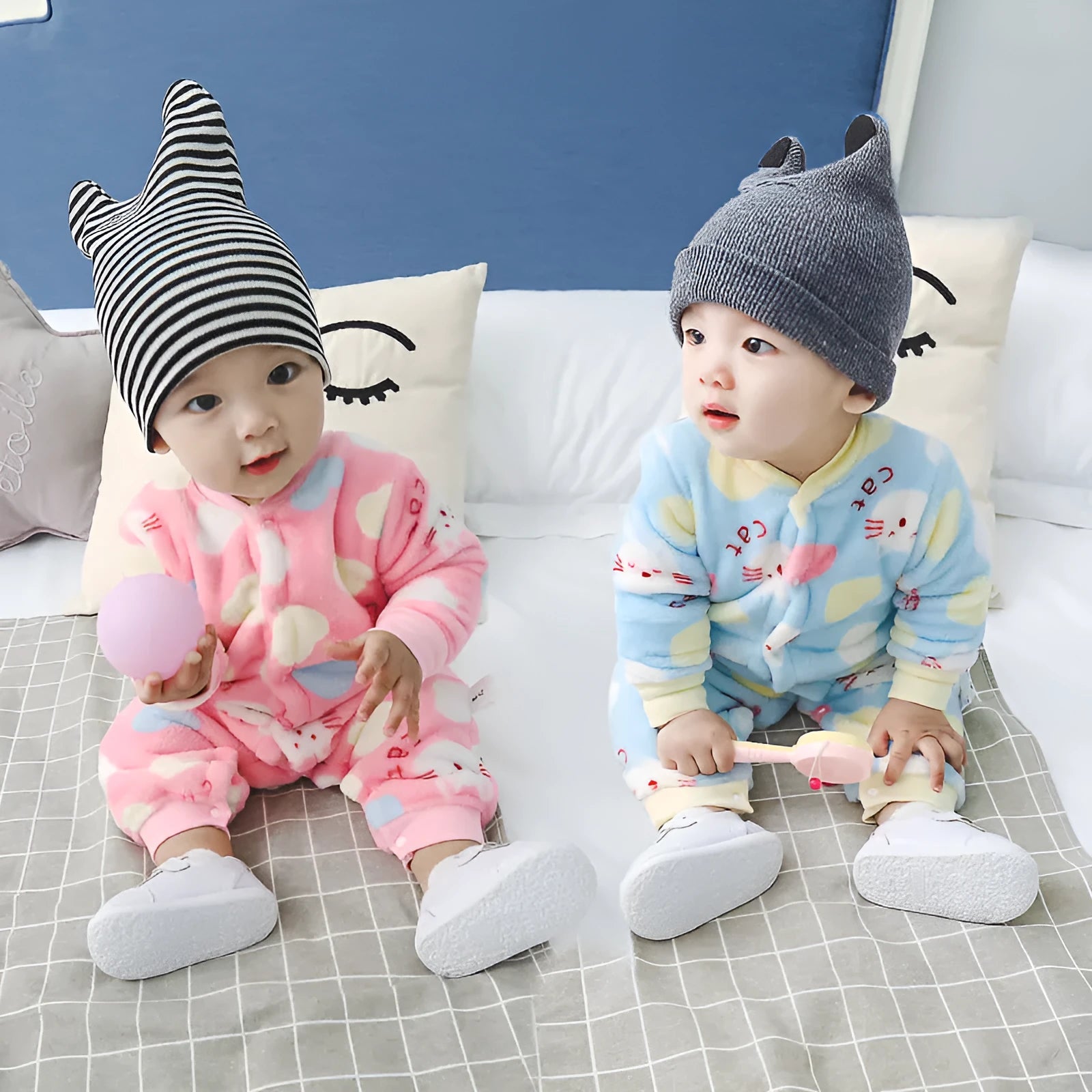 Baby wearing long sleeve flannel romper with animal print design