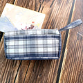 Square canvas stationery bag with double-layer compartments and striped pattern in red grid colour