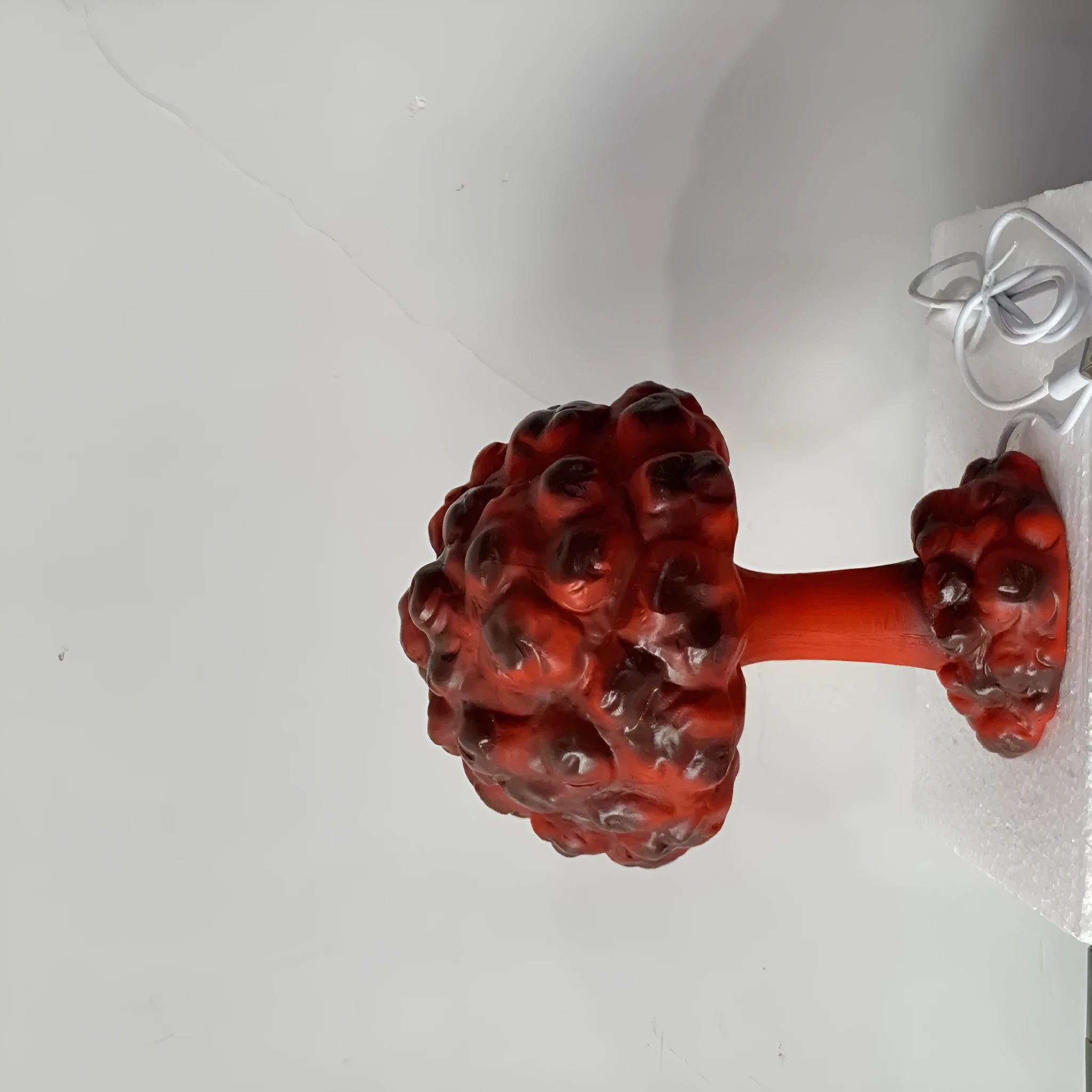 Modern art table lamp shaped like a mushroom cloud explosion, with USB cable for power.