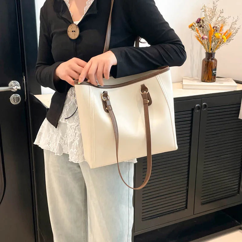PU leather contrast colour tote bag with horizontal square shape and outer slit pocket.