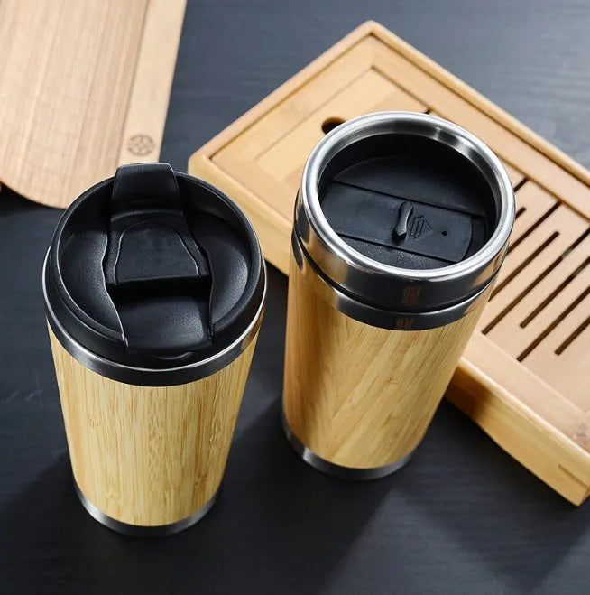 Bamboo travel coffee cup with thermal insulation, leak-proof lid, and 420ml capacity on foam pad