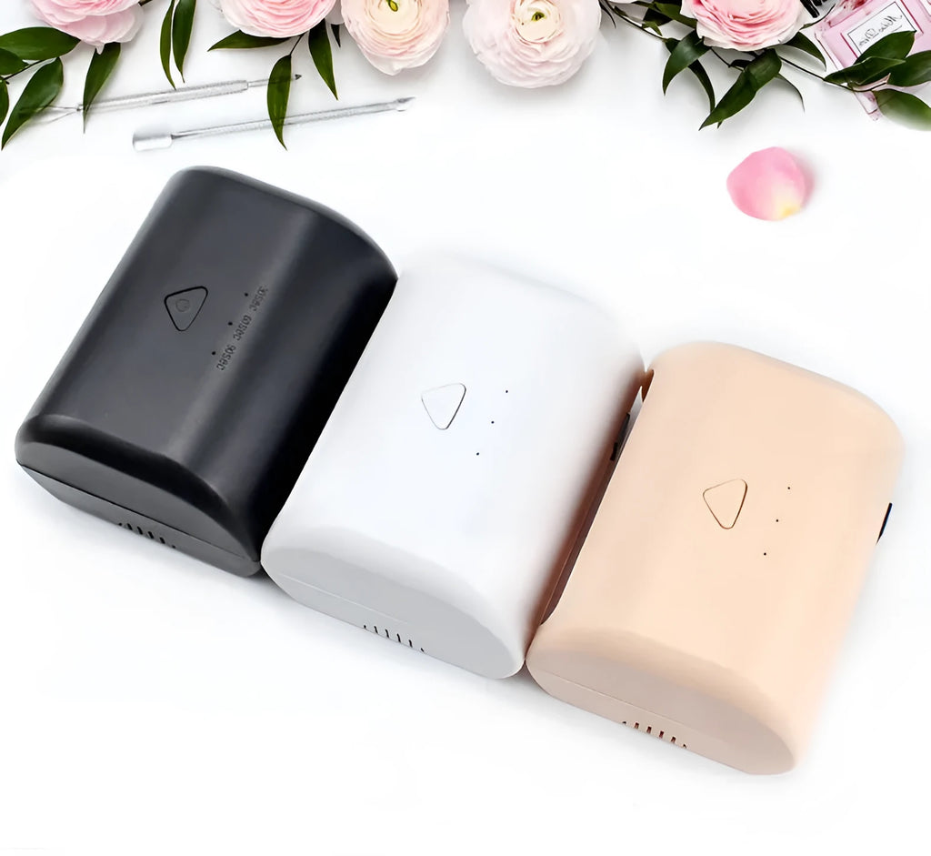 9W black LED UV nail lamp with dual light source and timer buttons on a white surface