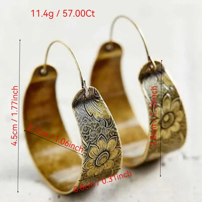 Gold electroplated alloy earrings with hollow geometric petal pattern design