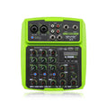 Green USB reverb audio processor and mixer unit with power adapter and cables on a desk.