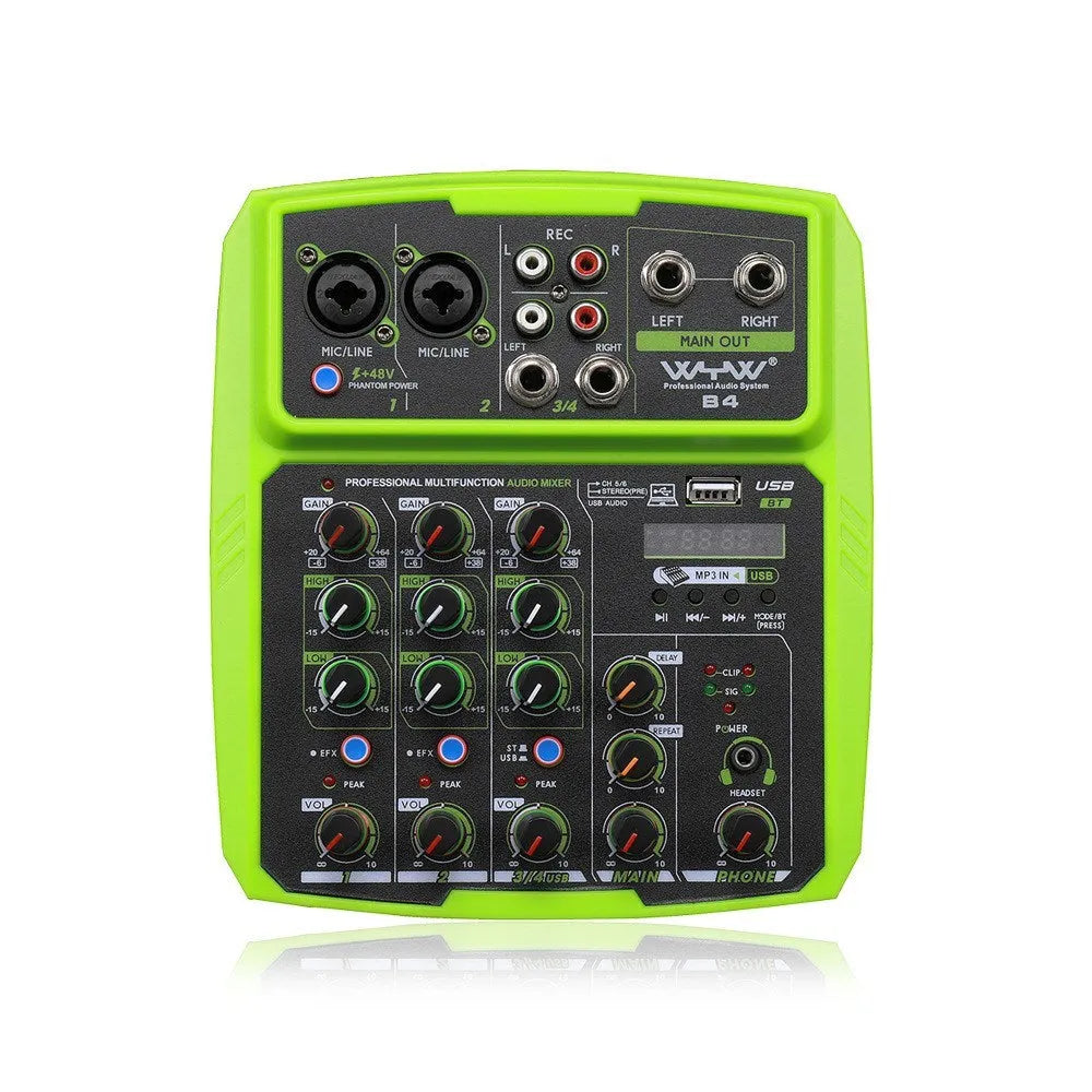 Green USB reverb audio processor and mixer unit with power adapter and cables on a desk.