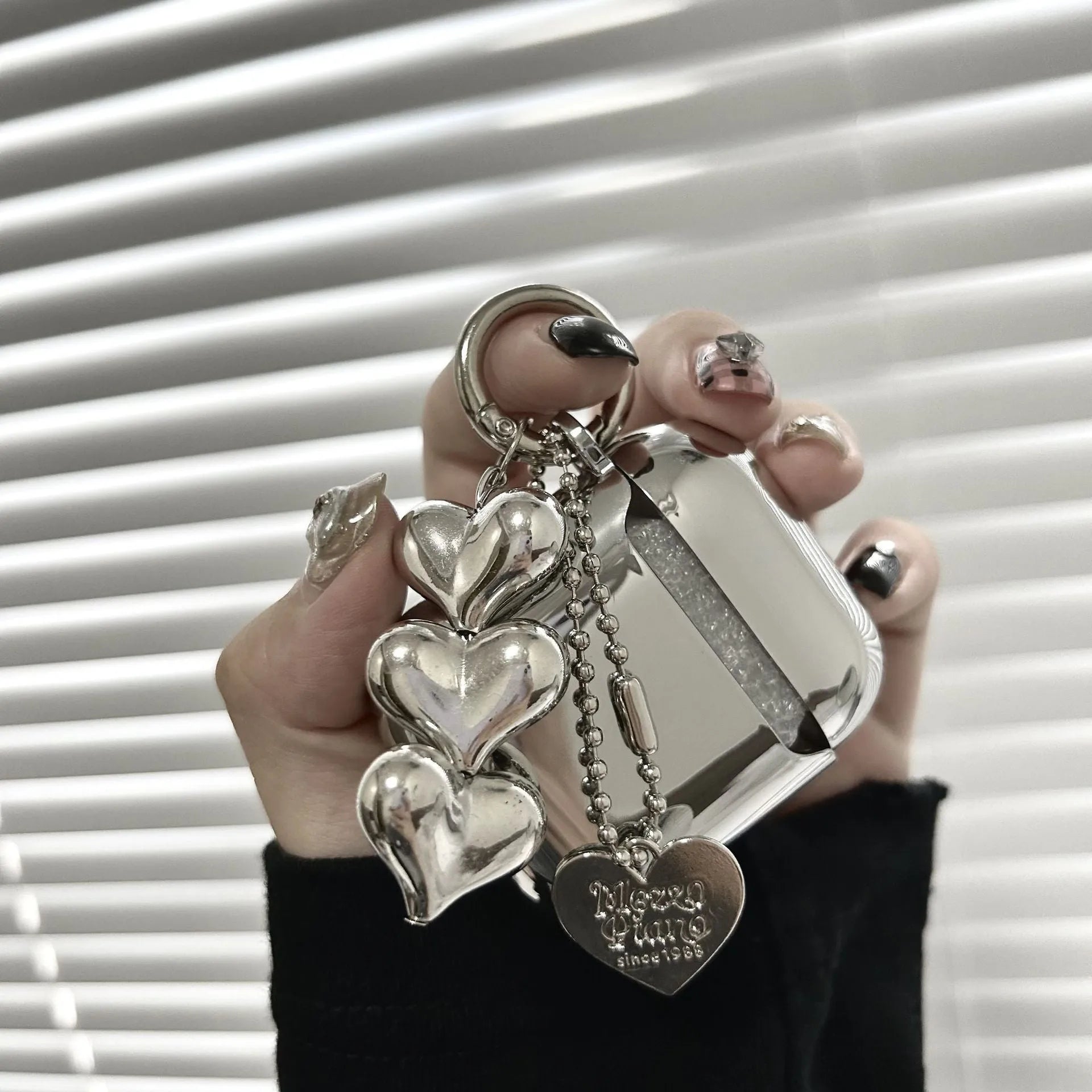 Electroplated solid colour TPU AirPods case with heart pendant charm and chain attachment