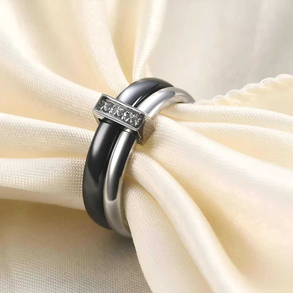 Glossy ceramic women's ring with inlaid zirconium design in geometric shape, shown in gold white finish.