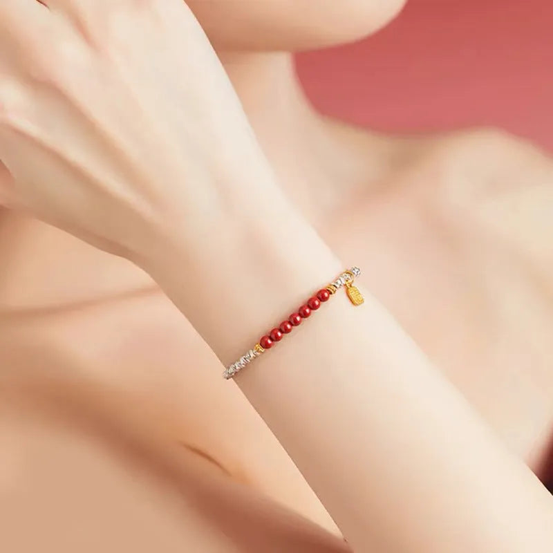 Silver electroplated copper lucky beads bracelet with geometric round beads on wrist