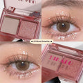 Two-tone eye shadow plate showing pink and black matte shimmer powder for punk makeup styles