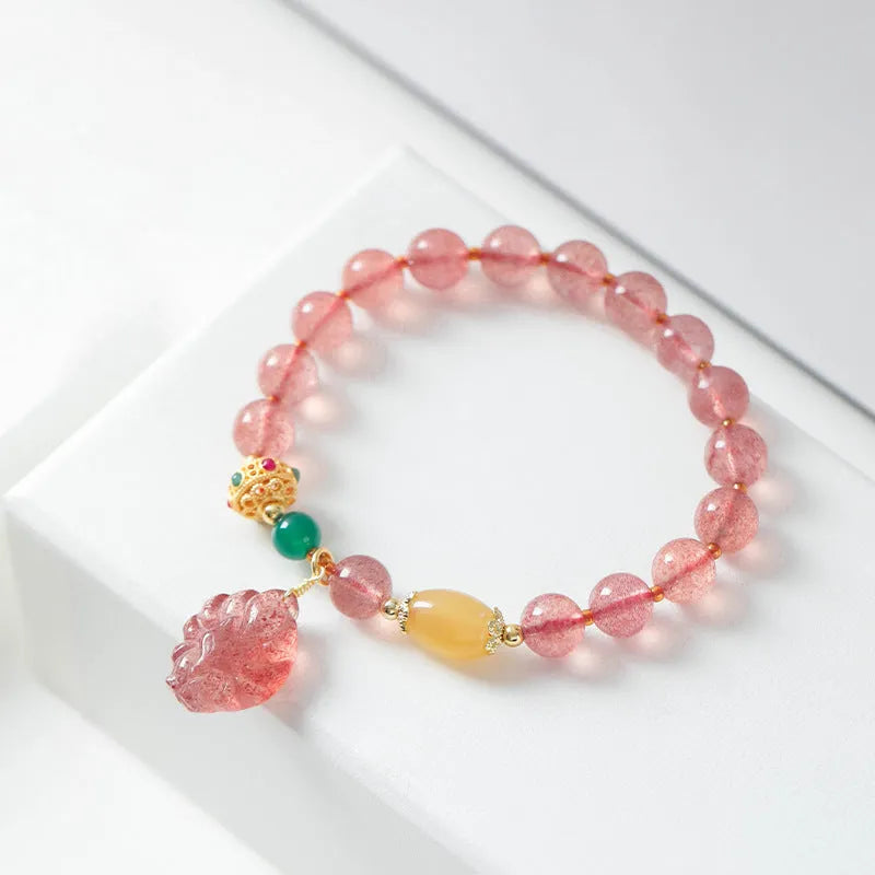Women's crystal bracelet with strawberry quartz beads in nine tail fox design