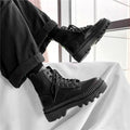 Men's black frosted leather Dr. Martens platform ankle boots with a side zip fastening.