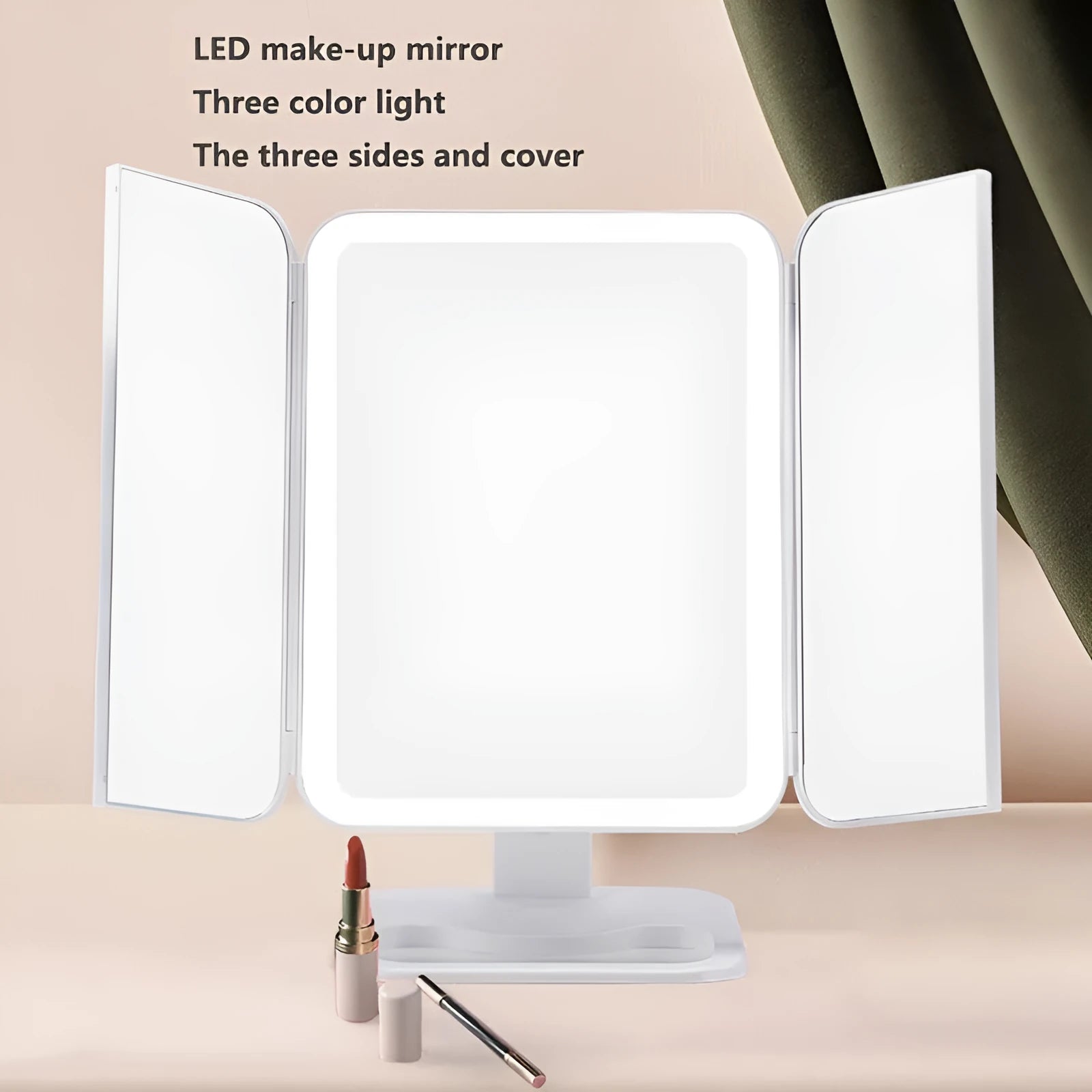 Trifold LED makeup mirror with 68 lights, 10X detachable magnifier, silver surface, rotating 180 degrees on a tabletop