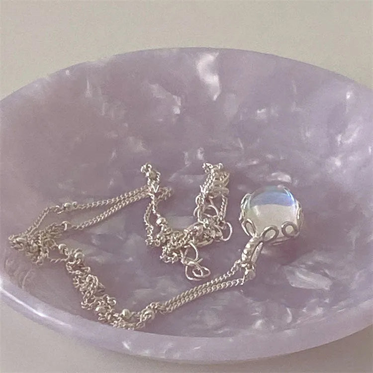 Geometric ornamental stone pendant on a 925 sterling silver curb chain necklace for women.