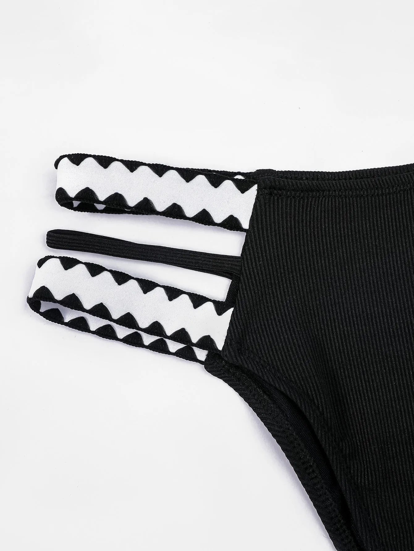 Black women's bikini swimsuit with a hollowed-out split design, showing front and back views.