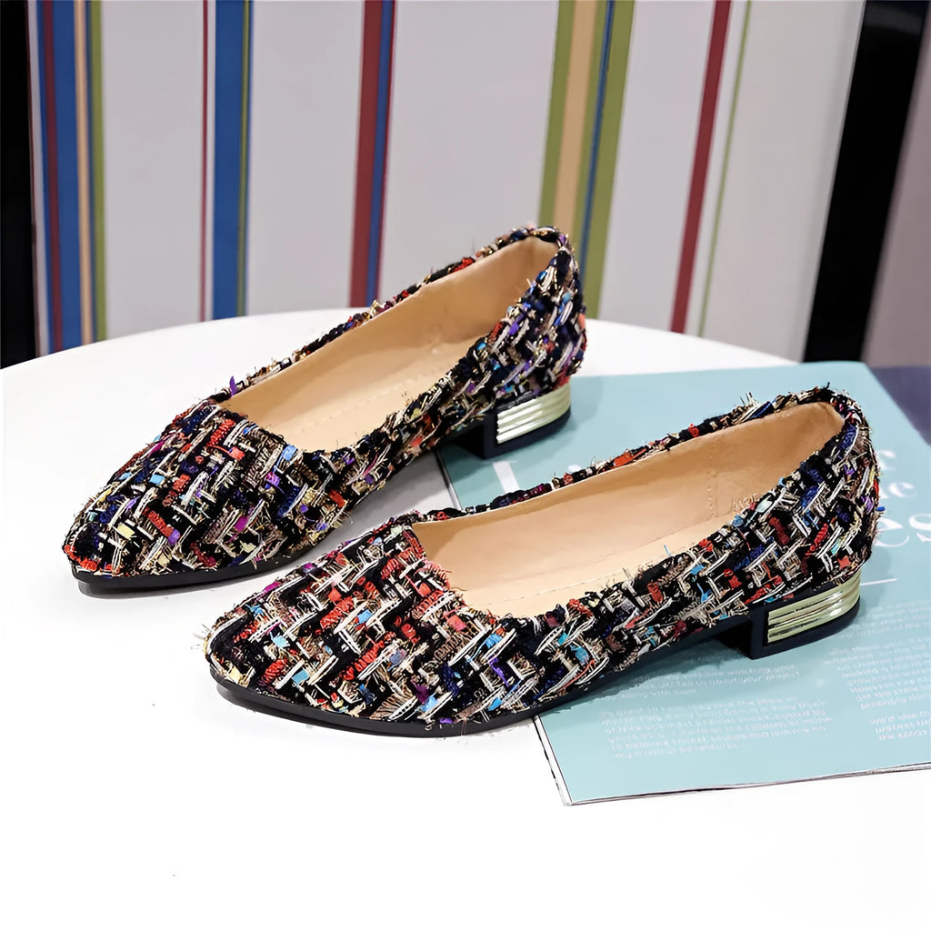 Women's black and white classic low-cut canvas shoes with pointed toe design and shallow mouth opening