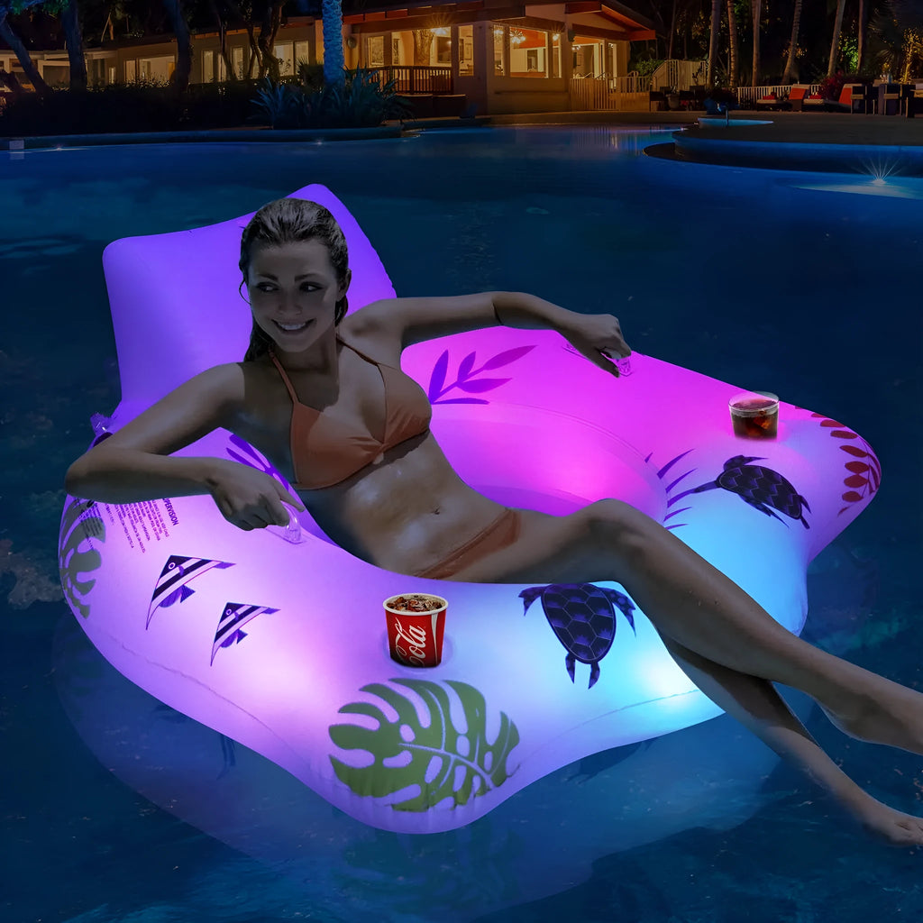 White luminous U-shaped inflatable float seat glowing in a swimming pool at night.