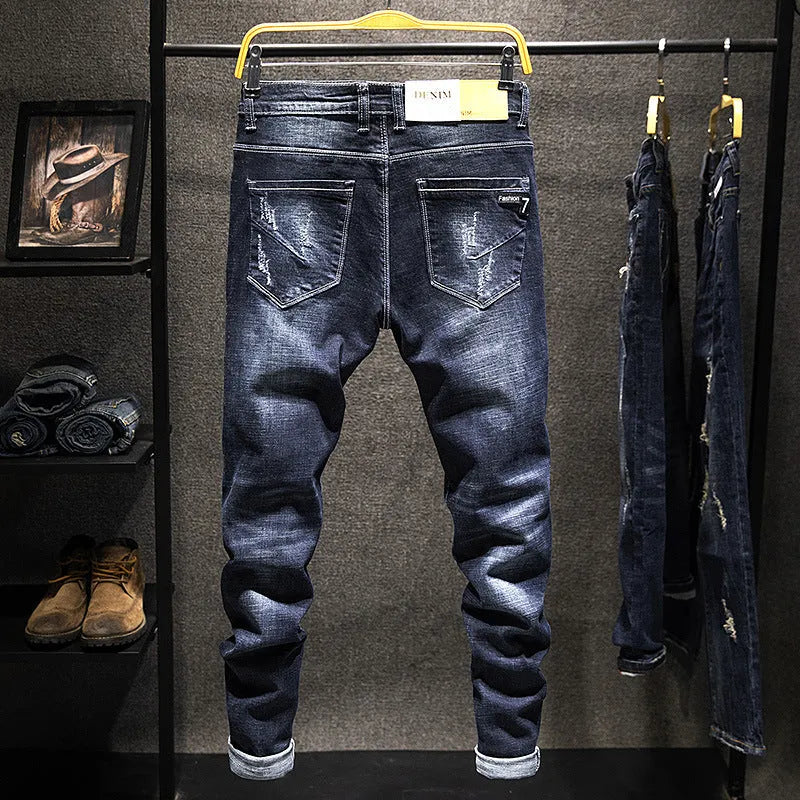 Men's slim-fitting skinny jeans in dark blue denim with a mid-waist design.