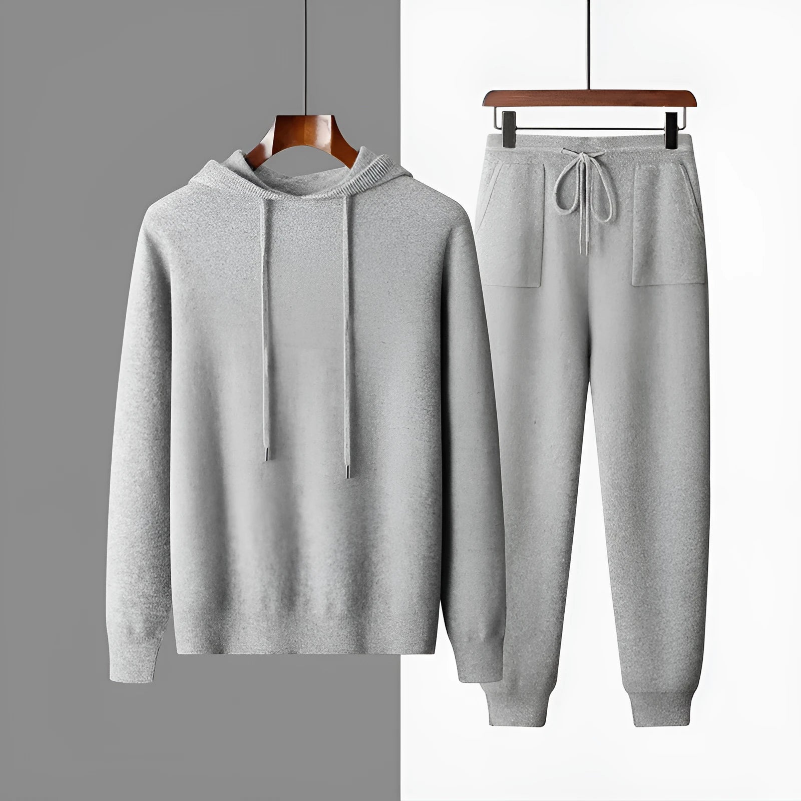 Men's light grey hooded knitted sweatshirt and matching long trousers casual set.