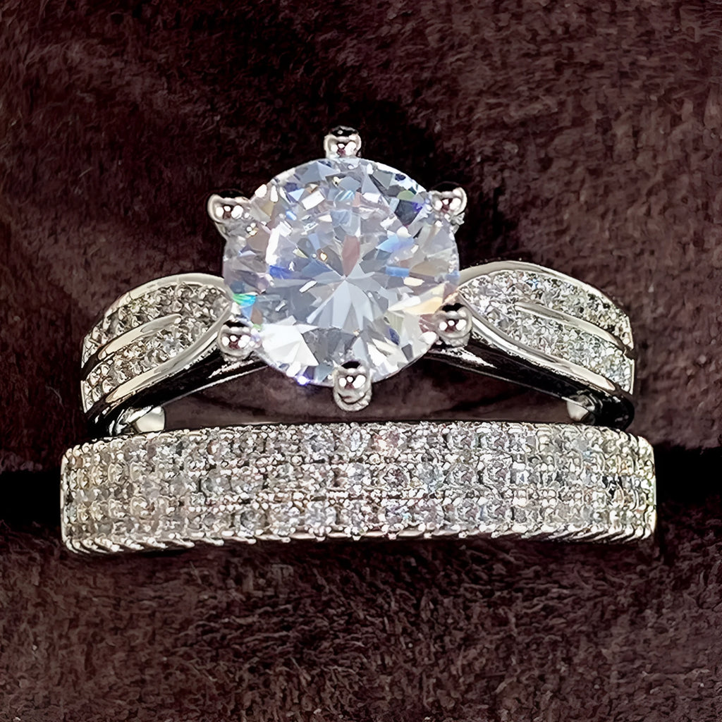 White gold colour alloy geometric wedding ring bracelet with round detail on a hand.