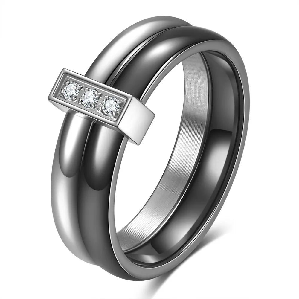 Glossy ceramic women's ring with inlaid zirconium design in geometric shape, shown in gold white finish.