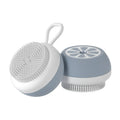 A yellow soft silicone pet bath brush with a 3D massage head on one side and a comb on the other, shown on a blue background.