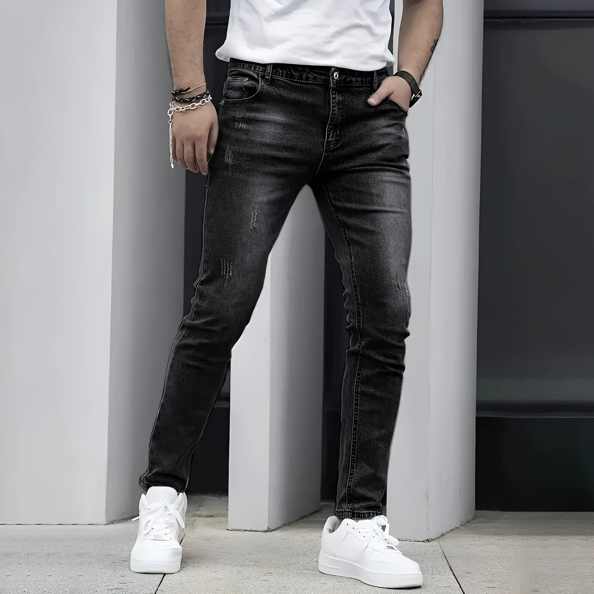 Men's slim-fit stretch jeans in dark blue on a neutral background.