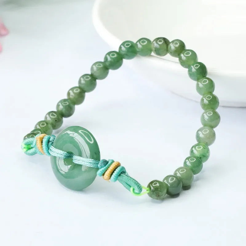 Emerald green jade bracelet with peace buckle clasp and star design elements