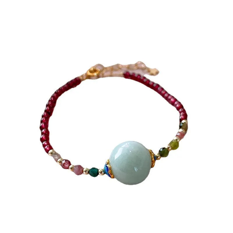 Aquamarine Chinese style garnet coloured tourmaline bracelet with a drop shape.