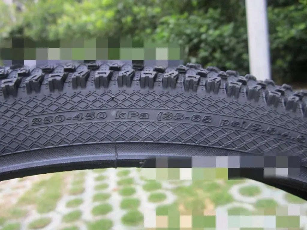 Ultralight puncture-proof mountain bike tyre showing tread pattern and sidewall in available sizes