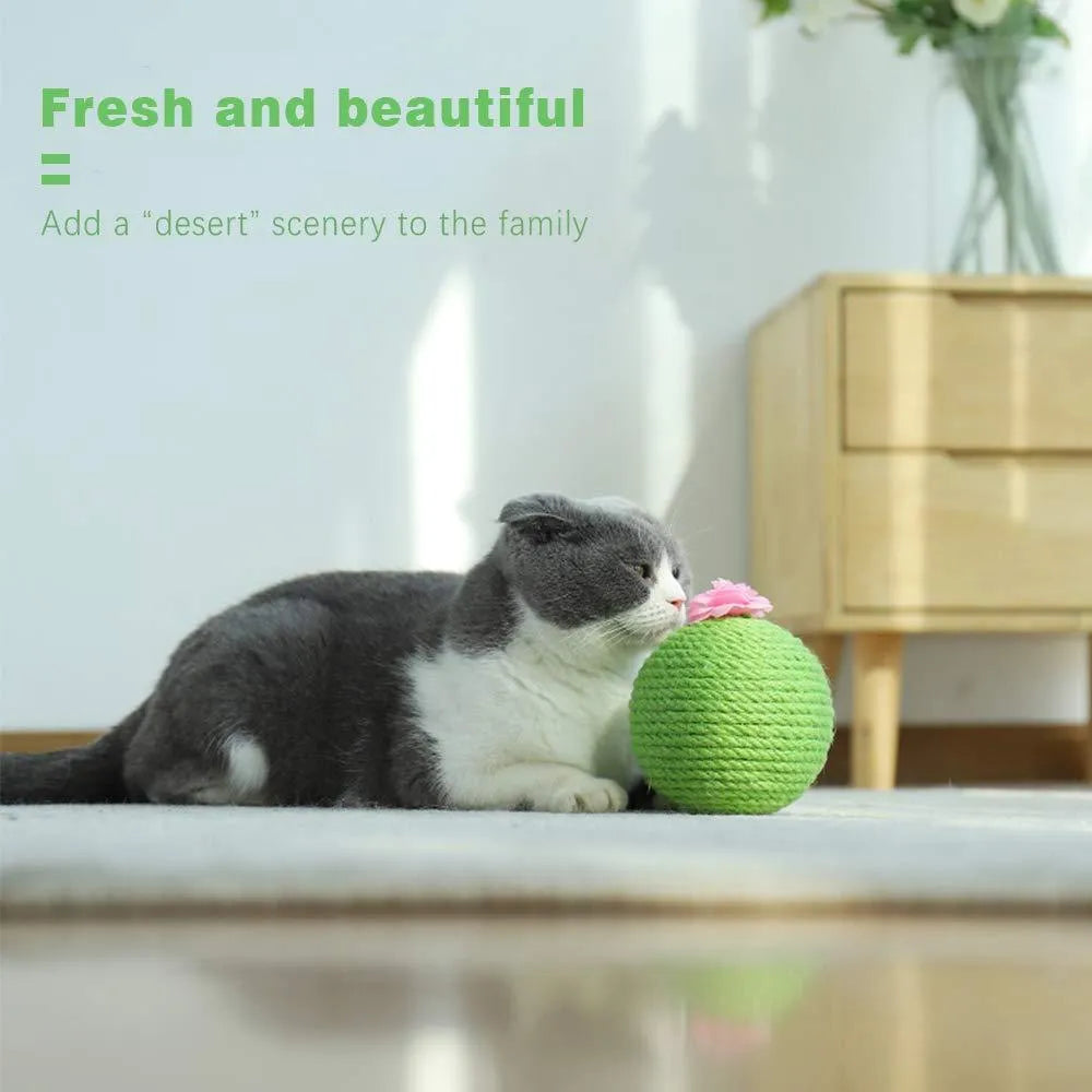 Green interactive cat toy with sisal scratcher and tumbler ball on tree tower base for indoor play