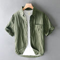 Men's apricot pure cotton short sleeve casual shirt with loose fit on a hanger.
