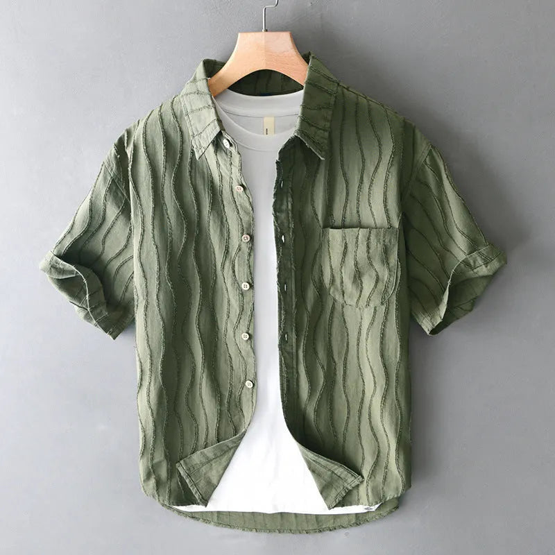Men's apricot pure cotton short sleeve casual shirt with loose fit on a hanger.