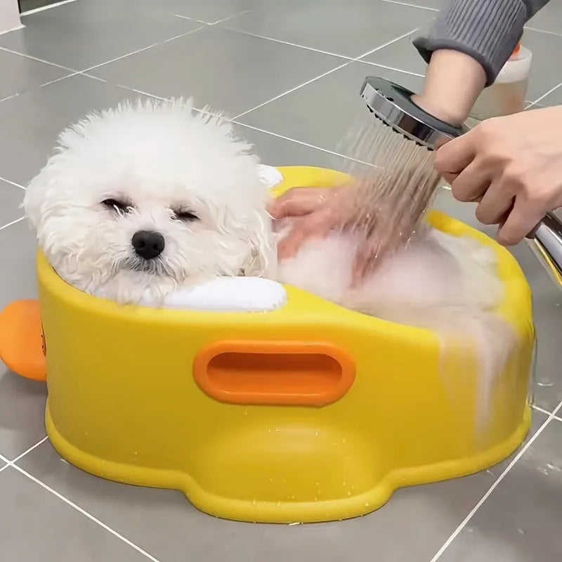Blue duck-shaped PVC bathtub for washing dogs and cats on a plain background.