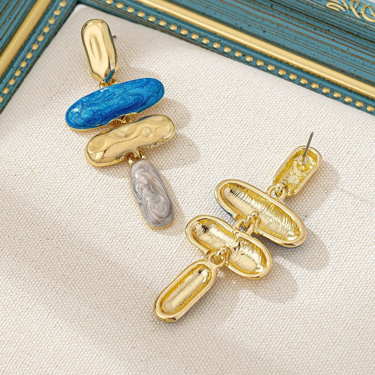 Geometric zinc alloy stud earrings with electroplated multicolour finish and butterfly fastenings