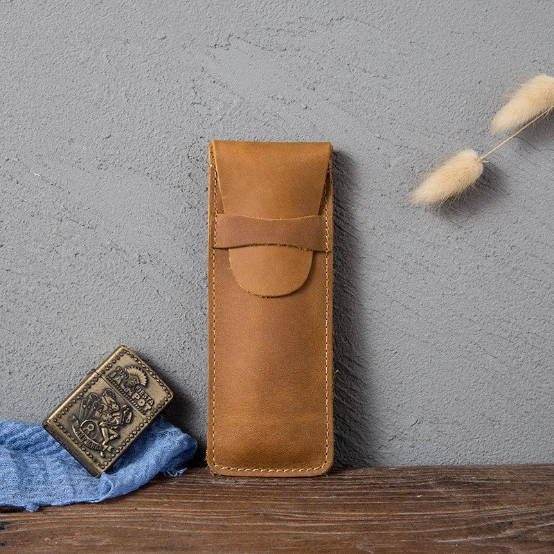 Brown vintage leather pencil case measuring 16x6cm open showing interior