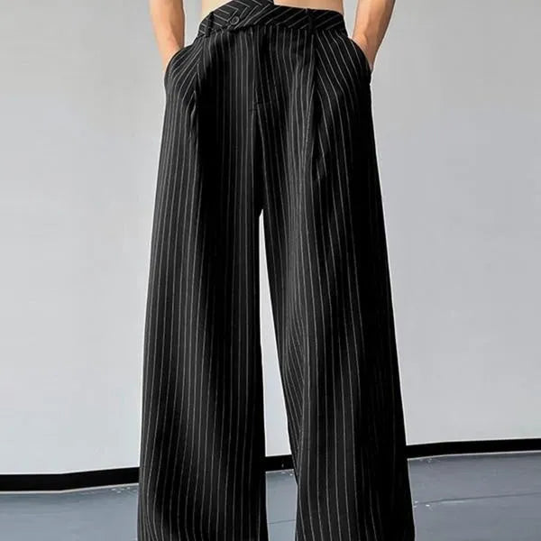Men's black vertical striped pleated casual trousers showing elastic construction detail