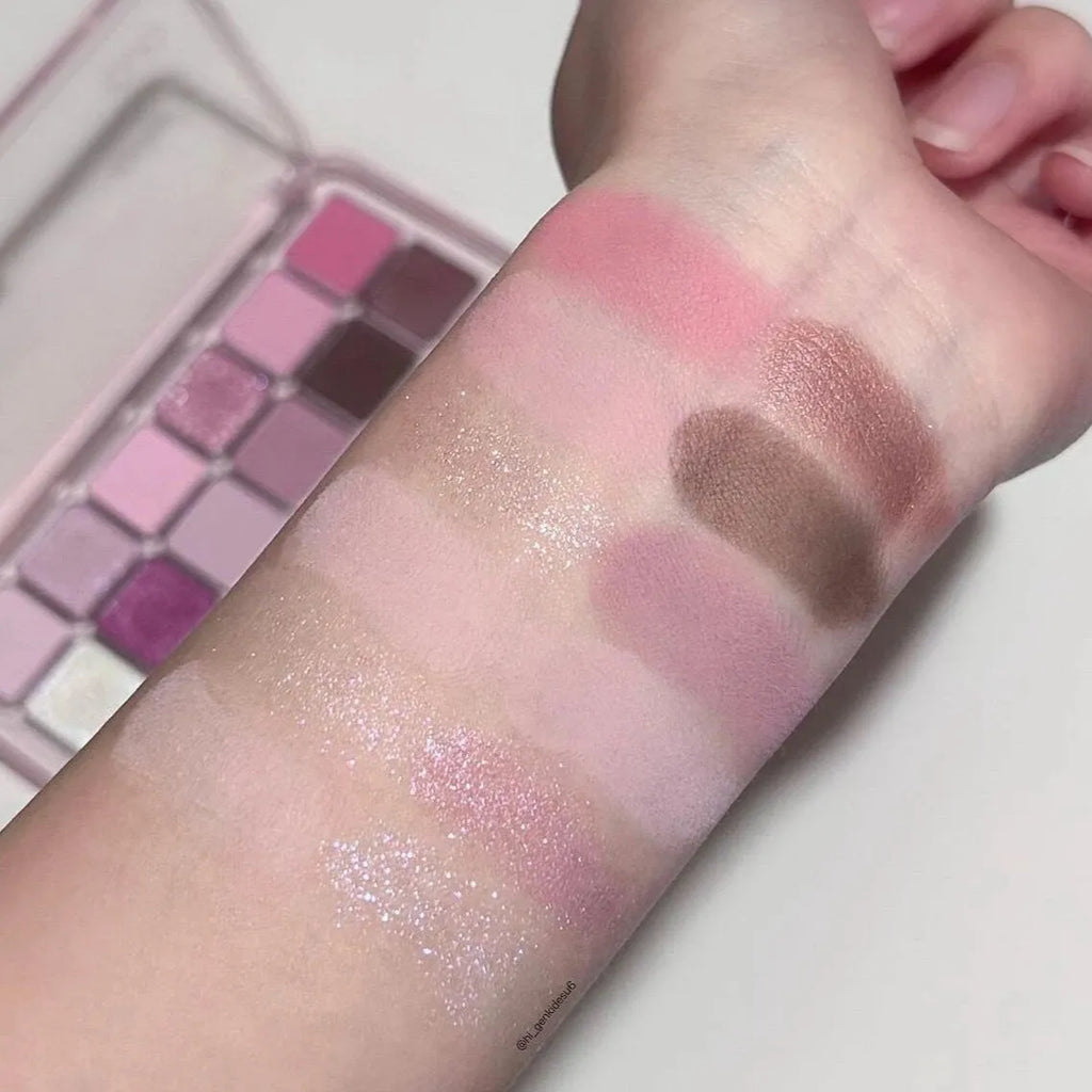 Makeup eyeshadow palette showing twelve different colours in compact case